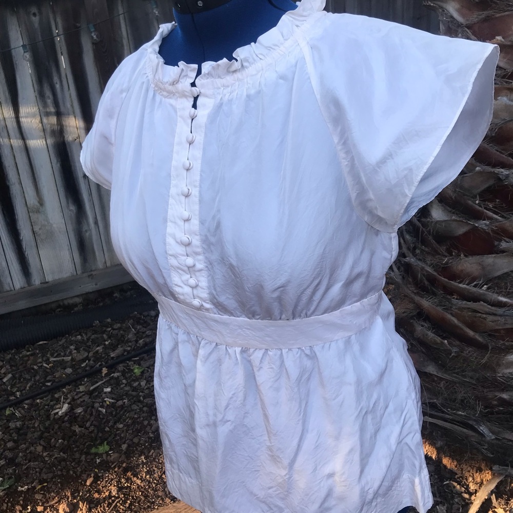 Size L. Egg shell white. Silk top.